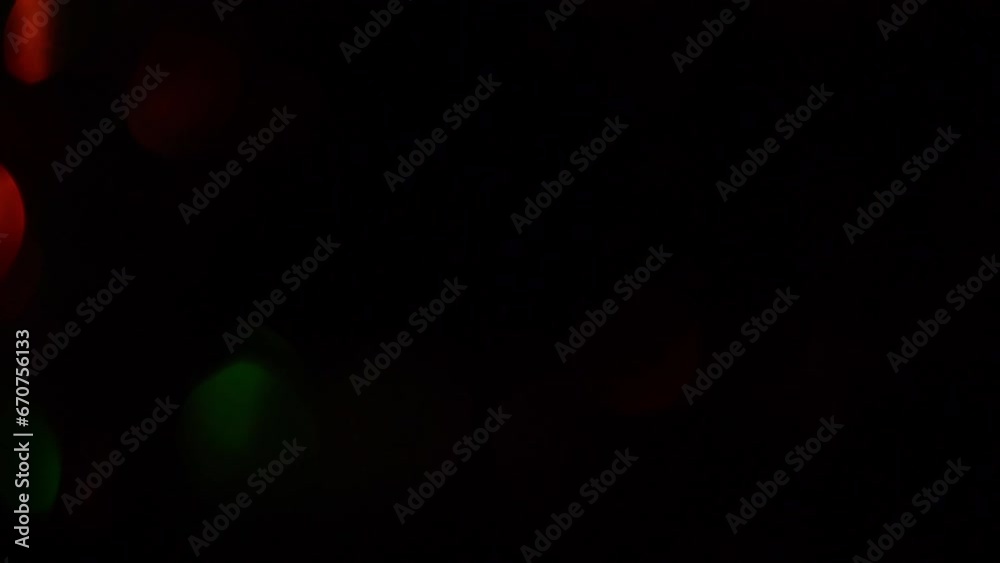 Iridescent Christmas bokeh with fading. Christmas transition for footages. Illuminated green and red defocused bokeh circles move from corner to corner and sparkle. Iridescent Christmas bokeh with fading. Christmas transition for footages. Illuminated green and red defocused bokeh circles move from corner to corner and sparkle.