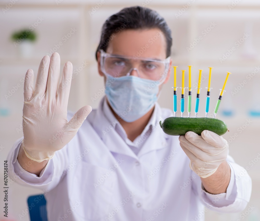 Male nutrition expert testing food products in lab