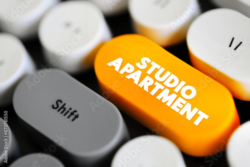 Studio Apartment in which the normal functions of a number of rooms often are combined into a single room, text concept button on keyboard photo