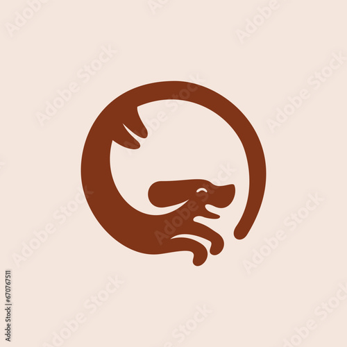 silhouette of a happy and smiling dog chasing its tail logo