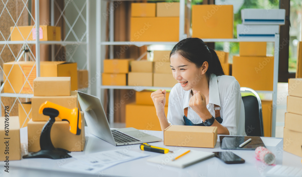 Small business owners Online Retailers rejoice and be happy with orders coming in from online customers.concept shopping online Small business owners Online Retailers rejoice and be happy with orders coming in from online customers.concept shopping online