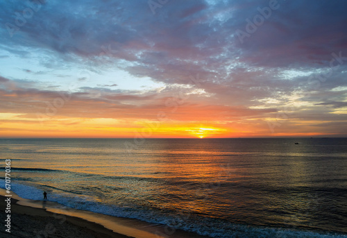 In morning, fisherman catches fish on ocean while it is still dark © ungvar