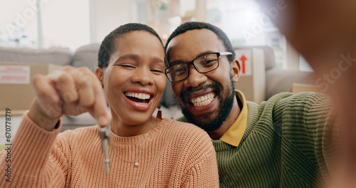 Black couple, portrait and a selfie with keys in a new home after moving and relocation. Smile, showing and an African man and woman excited with a photo for ownership or buying of a house together