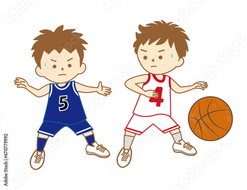 バスケットボールの試合でドリブルをする男の子とディフェンスをする男の子