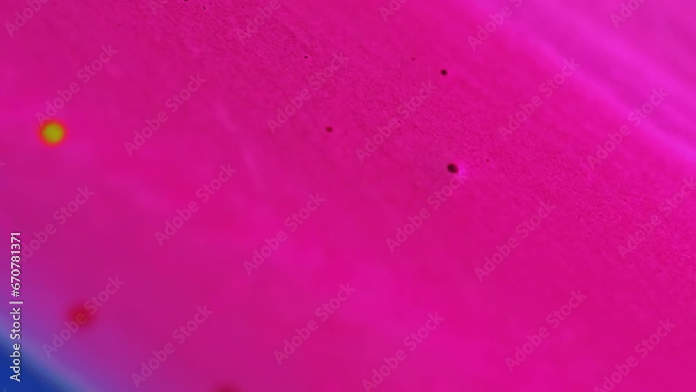 Shimmering flow background. Glamourous lacquer. Nail polish. Bright pink abstract smooth texture glitter liquid spreading on surface in cosmetic advertising. Shimmering flow background. Glamourous lacquer. Nail polish. Bright pink abstract smooth texture glitter liquid spreading on surface in cosmetic advertising.