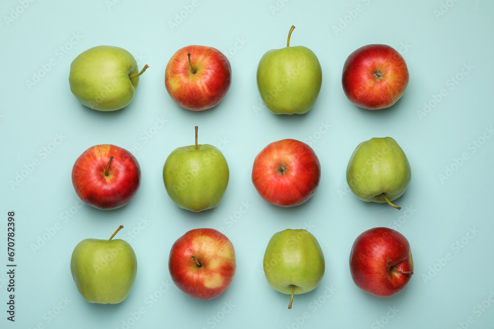 Fresh colorful apples on light blue background, flat lay Fresh colorful apples on light blue background, flat lay