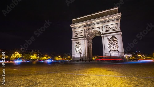 A 4K Timelapse of Rush hour traffic swirling around the iconic Arc de Triomphe near the Champs Elysees in Paris, France.