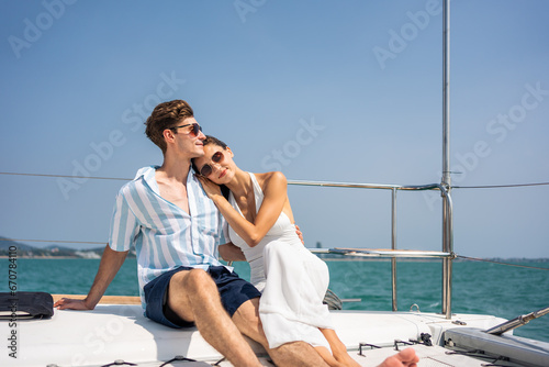 Caucasian romantic couple looking at beautiful view during yachting.  © Kawee