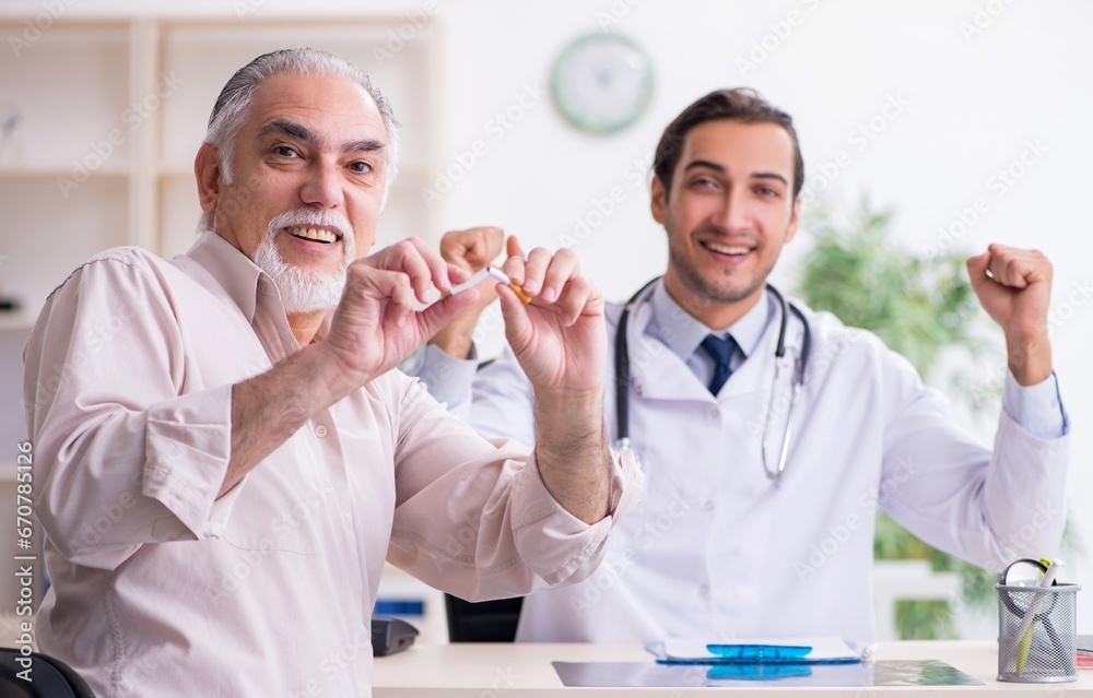 Young male doctor and old patient in antismoking concept Young male doctor and old patient in antismoking concept