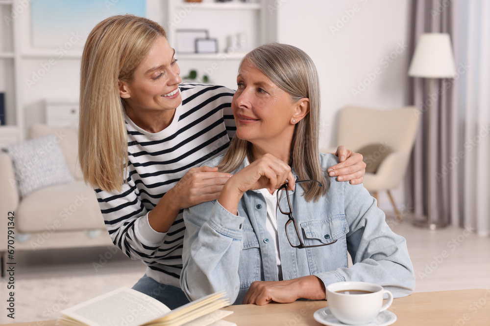 Happy mature mother and her daughter at home Happy mature mother and her daughter at home