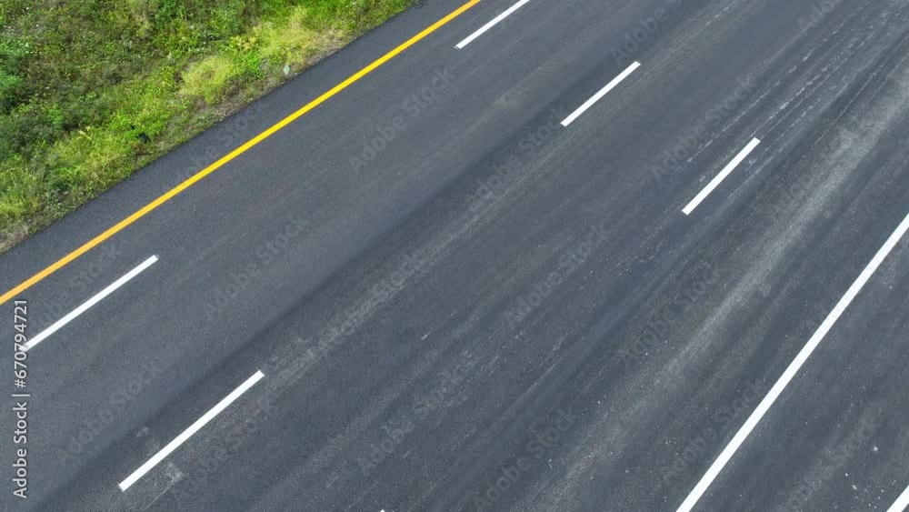 Drone aerial view : A mesmerizing panorama unfolds as a drone soars above the deserted intercity motorway, a testament to modern engineering and open road possibilities. Transportation concept. 4K.
Drone aerial view : A mesmerizing panorama unfolds as a drone soars above the deserted intercity motorway, a testament to modern engineering and open road possibilities. Transportation concept. 4K.