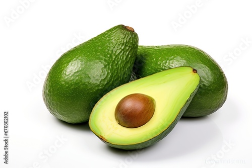 Avocado fruit with leafs isolated photo. Avocado whole, half, slice, leaves on white background. Avocado slices with leaf and zest isolated. With clipping path. Full depth of field.