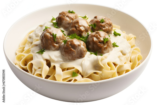 Homemade creamy pasta with meatballs, served in plate. Vertical image, isolated on white background 