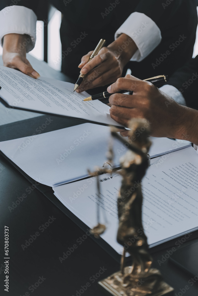 Naklejka premium Business and lawyers discussing contract papers with brass scale on desk in office. Law, legal services, advice, justice and law concept picture with film grain effect