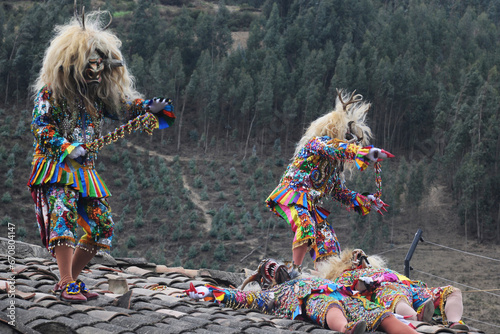 Paucartambo Peru during the procession of the Saqras mischievous devils surround it from the roofs and balconies but they cannot approach the Virgin of Carmen.