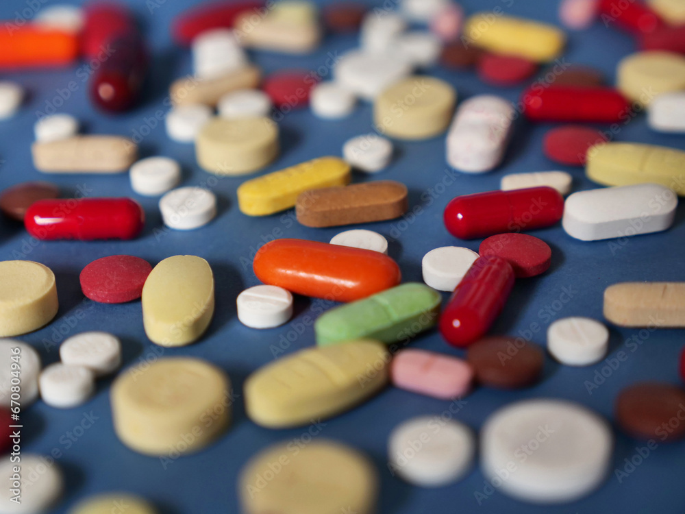 Drug medicine background, pharmaceutical pills and tablets on blue Drug medicine background, pharmaceutical pills and tablets on blue