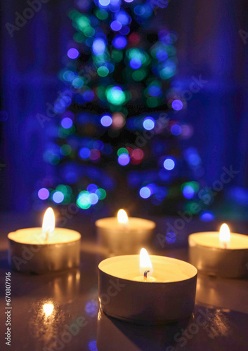 Holiday  winter mood  red candles and Christmas tree