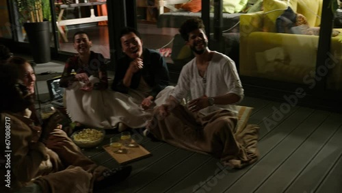 Wallpaper Mural Diverse young friends laughing at a funny movie on a patio Torontodigital.ca