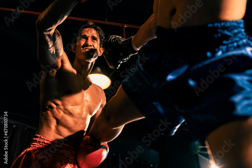 Asian and Caucasian Muay Thai boxer unleash their power in fierce boxing match. Two MuayThai boxer with strong muscular body exchanging punch and strike with relentless combat prowess. Impetus © Summit Art Creations