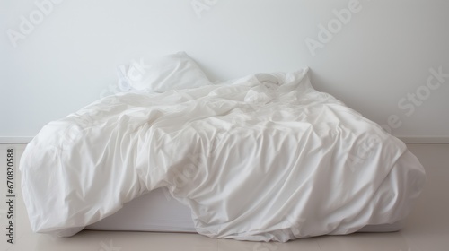 A simple bedding with a comforter photographed in a studio with nothing in the surroundings or in the background