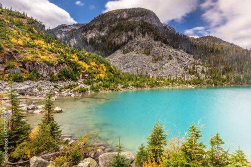 Autumn colors at Joffre Lakes Provincial Park in British Columbia. A colorful scene with the turquoise water of the upper Joffre Lake and Autumn colors.  photo