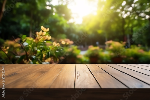 Wooden table top on blur green field background