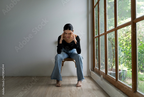 Depressed young Asian woman with mental health problem in mind need uttermost treatment from overthinking fatigue, disruptive thought, dissocial, anxiety and other mental health disorders . photo