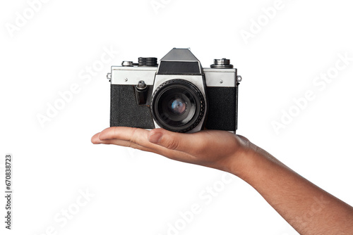 Camera in hand, photography and creative with vintage technology isolated on transparent png background. Person with retro gadget, photographer and picture journalist with lens, blog and hobby