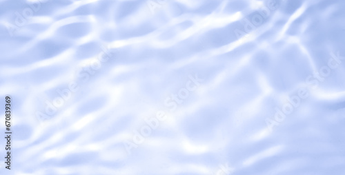 Natural background of water in summer. Blue surface. Clear water with ripples and splashes. water waves in sunlight The water surface has waves.