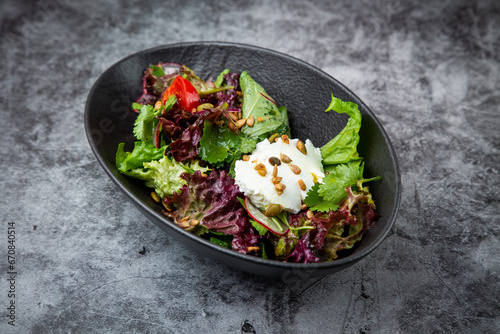 salad with spinach, eel, lime, sour cream, side view