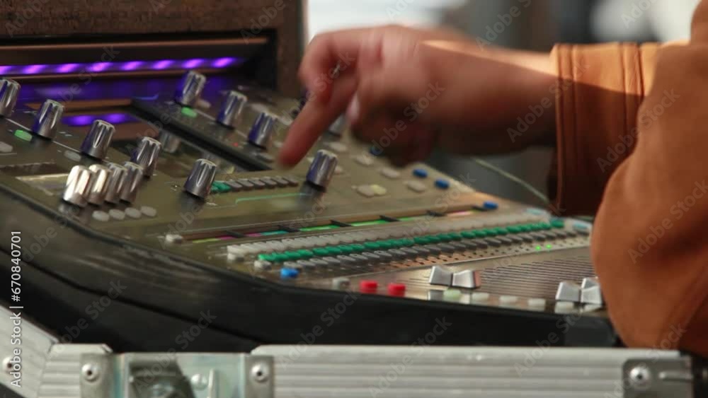 close up, hands of an audio technician pressing buttons and turning knobs of a studio audio mixer, hands of a man with brown skin, hispanic worker close up, hands of an audio technician pressing buttons and turning knobs of a studio audio mixer, hands of a man with brown skin, hispanic worker