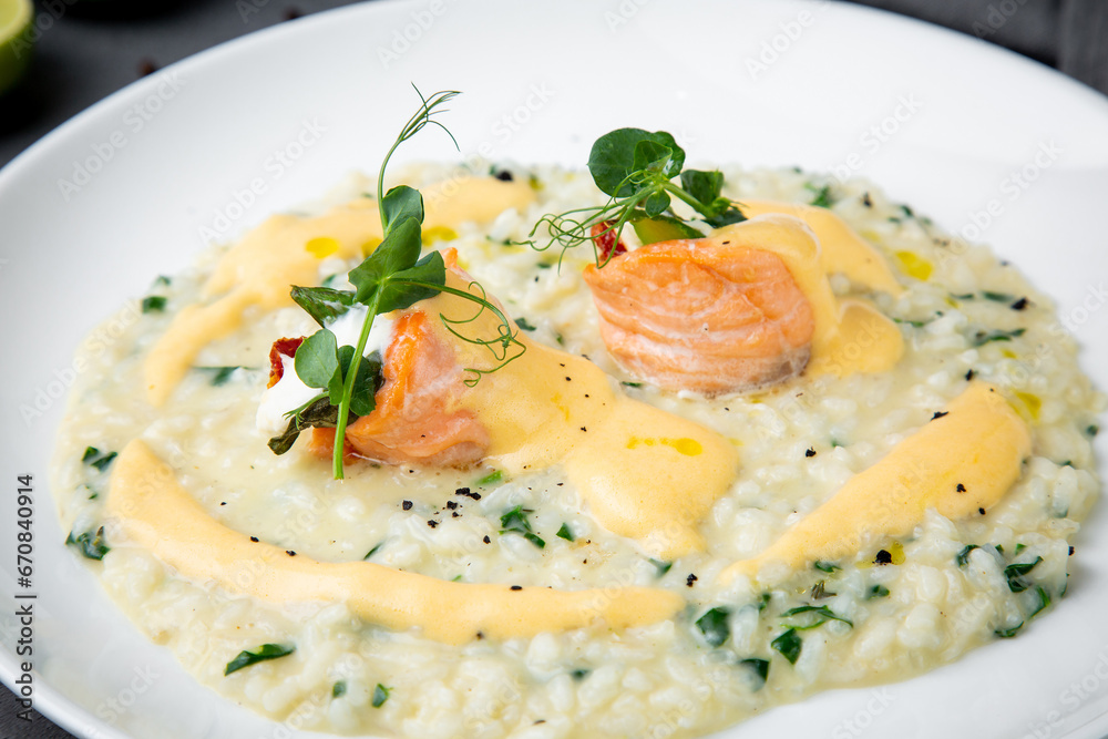 white rice porridge with herbs and fish, side view white rice porridge with herbs and fish, side view