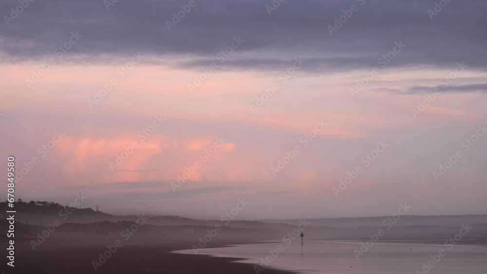 Man running at the end of the day on the beach in the fog with colorful reflections, peaceful and relaxing environment, 4K Man running at the end of the day on the beach in the fog with colorful reflections, peaceful and relaxing environment, 4K