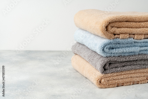 Stacked clean fluffy towels in a bathroom