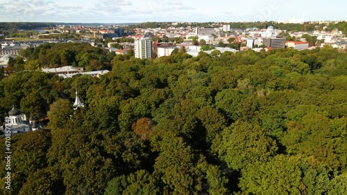 Drone footage over the Ramybes Park (Old Cemetery) and surrounding buildings in Kaunas, Lithuania photo