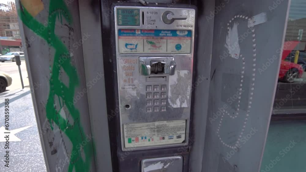Public payphone for emergency call on street.