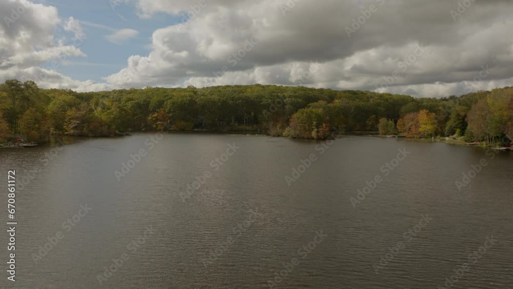 Flyover beautiful lake in the Hudson Valley area of New York state on a beautiful day in Autumn. Flyover beautiful lake in the Hudson Valley area of New York state on a beautiful day in Autumn.
