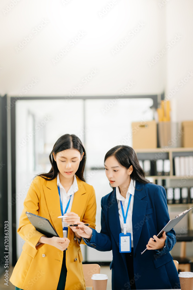 Portrait of success business people working together in modern office. Couple teamwork startup concept. Portrait of success business people working together in modern office. Couple teamwork startup concept.