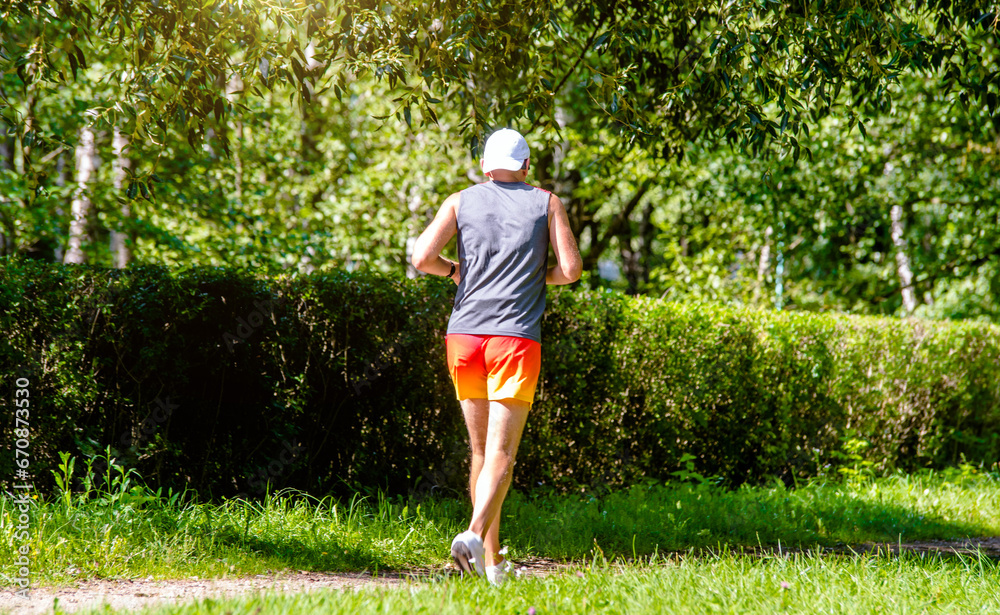 A man Jogging in a summer Park
