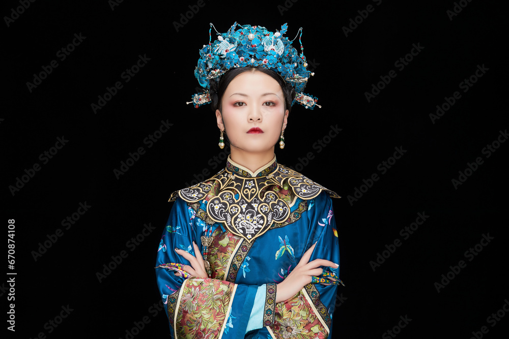 A Asian woman dressed in Qing Dynasty Empress attire