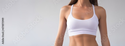 Close up unrecognizable fit woman's body with fitenss clothes and copyspace.