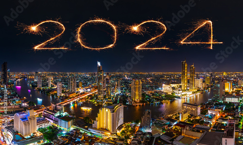 2024 happy new year fireworks celebrating over Chao Phraya river in Bangkok city at night, Thailand