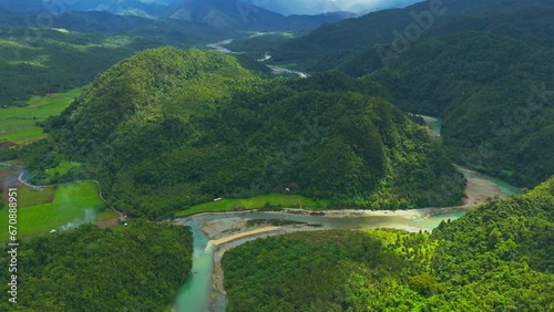 Drone View Panning Down Revealing Beautiful Valley and Daywan River, Surigao Del Norte, Philippines photo