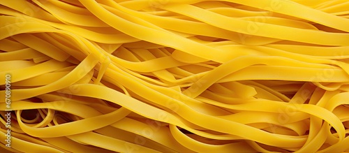 Foreground yellow noodles in close up