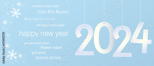 2024 Happy New Year in several languages greeting text on soft gradient background
