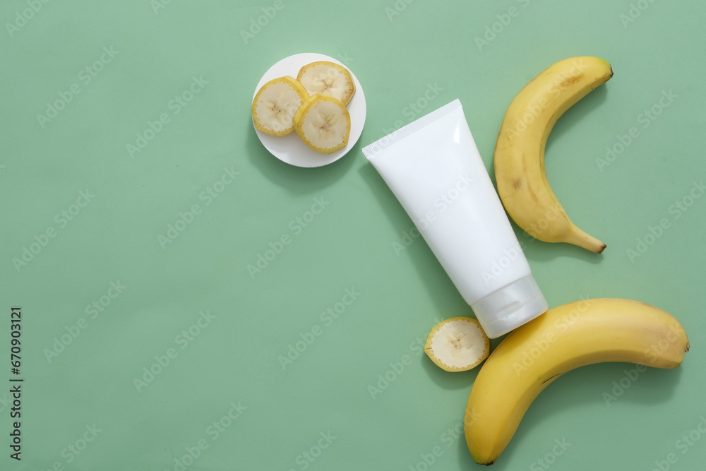 Top view of a white plastic tube decorated with fresh bananas on a