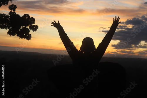 a silhouette of a group of people at sunrise in Bromo
