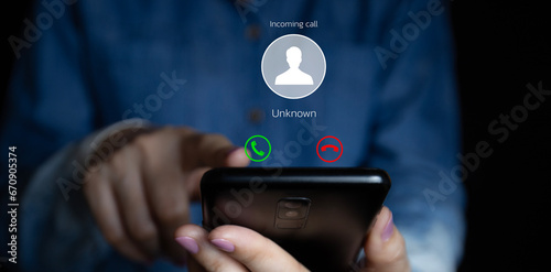 Woman receiving a call on her smartphone from an unknown number, malicious phone calls concept, POV shot