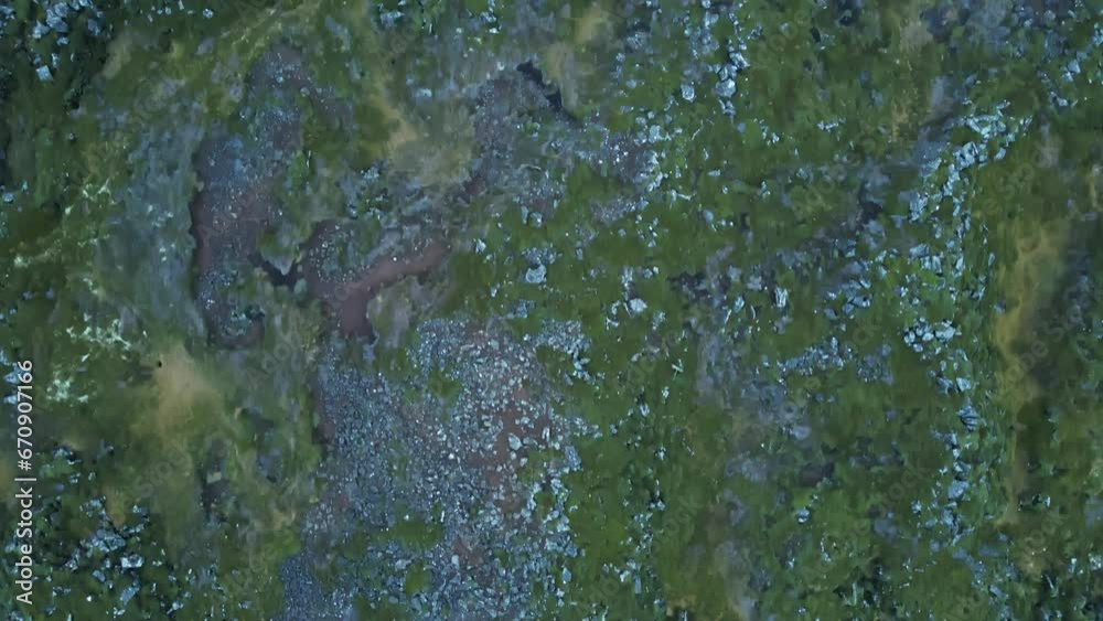 Top down aerial of Icelandic soil with lava rocks and green moss Top down aerial of Icelandic soil with lava rocks and green moss