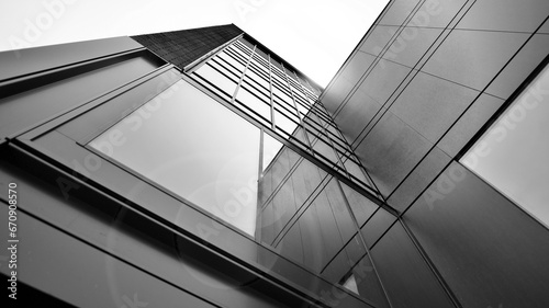 Abstract reflection of modern city glass facades. Modern office building detail, glass surface. Black and white. photo